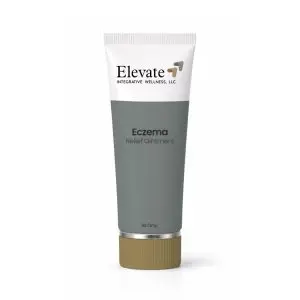Tube of Elevate Eczema Relief Ointment by Elevate Integrative Wellness, white top with gray/green body and brown cap on white background.