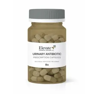 Prescription bottle labeled Elevate Urinary Antibiotic Capsules containing beige capsules inside the bottle.